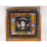 A stained glass effect panel with a portrait of gentleman inscribed Holbein, 20" x 19"