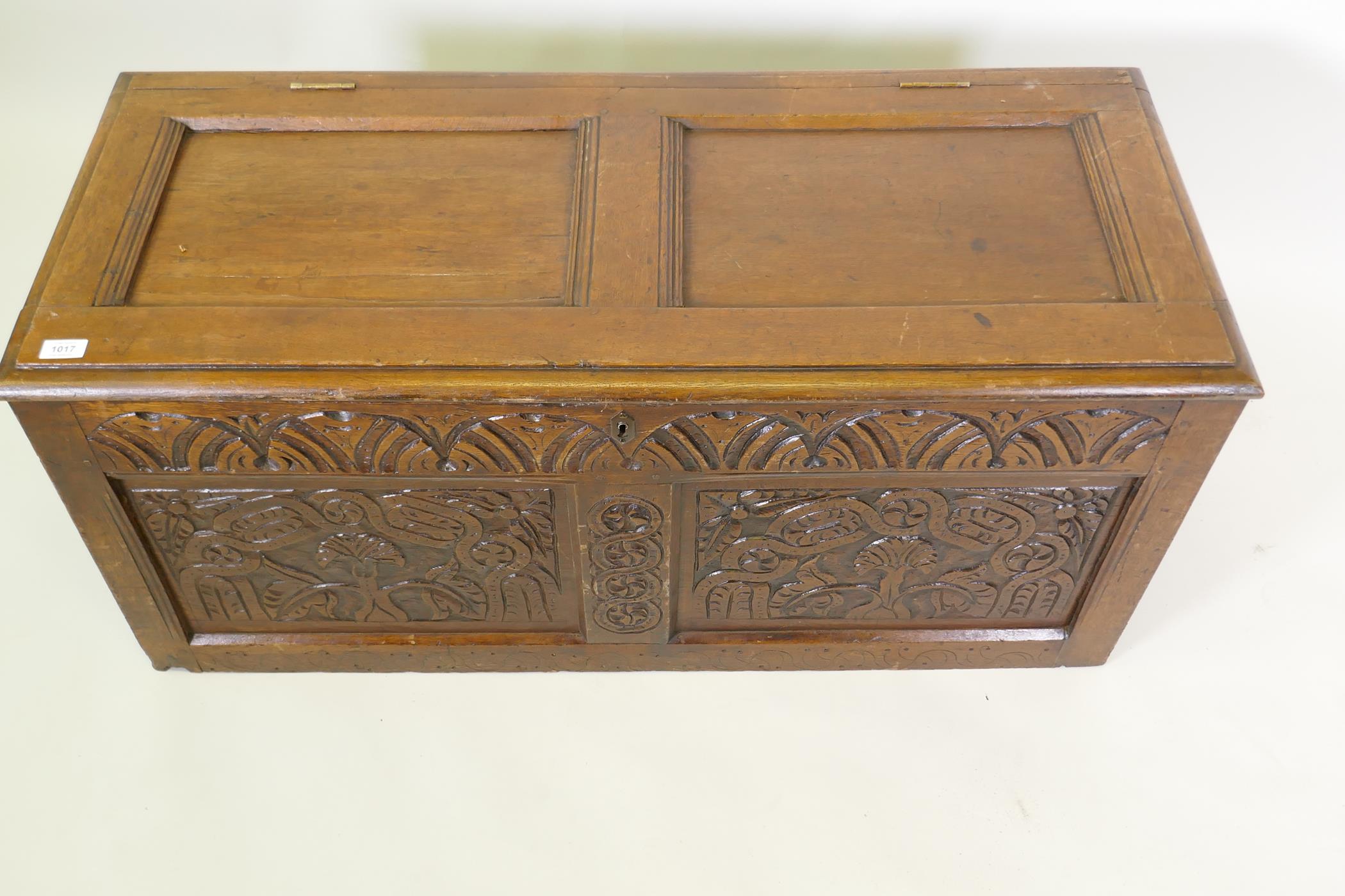 An C18th oak coffer with two carved panels and frieze and panelled top, 116 x 49 x 52cm - Image 3 of 4