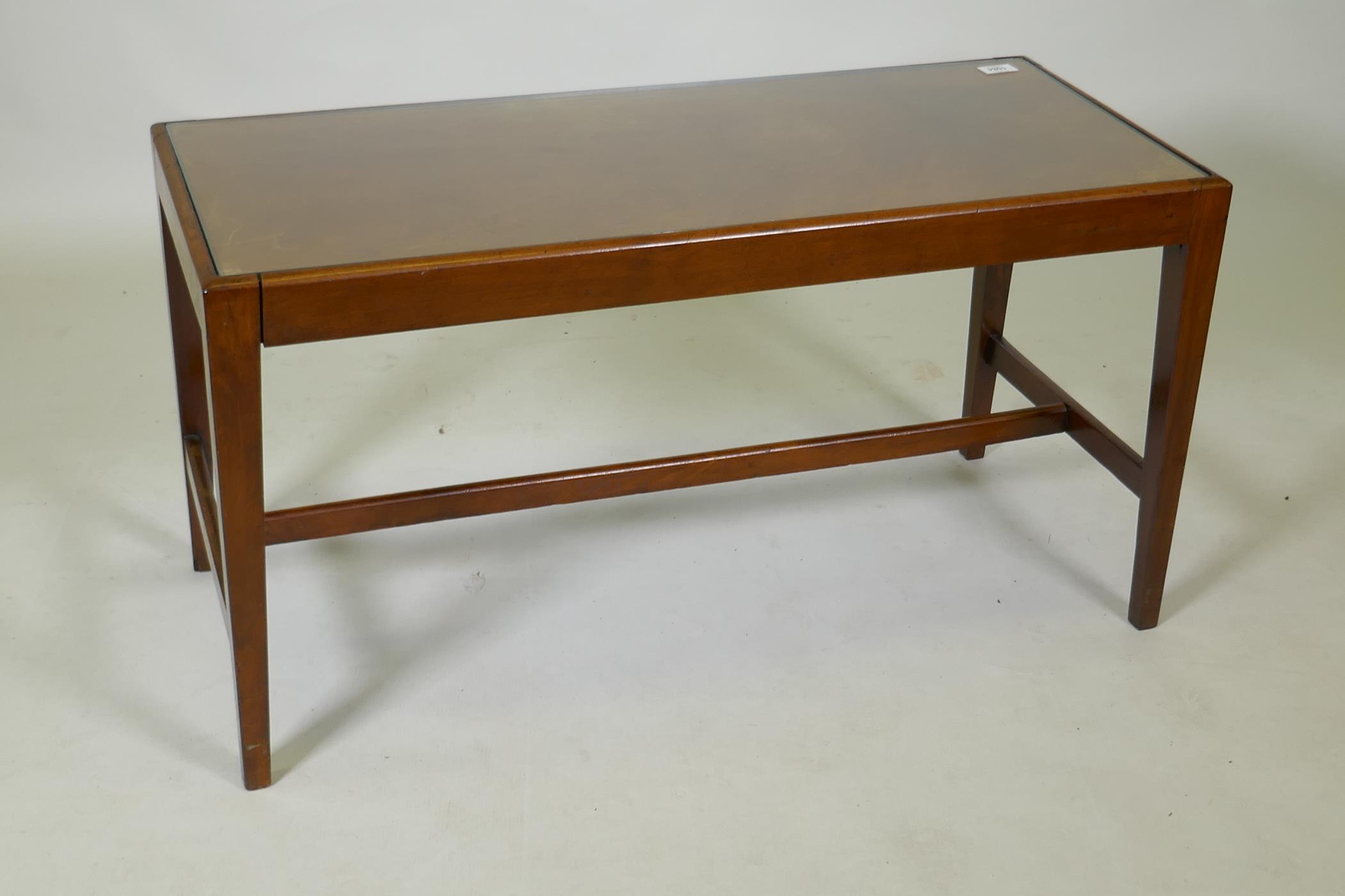 A mahogany occasional table with inset glass top, 40 x 92 x 49 cm