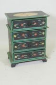 A small painted bedside chest of four drawers, 56 x 44 x 27cm