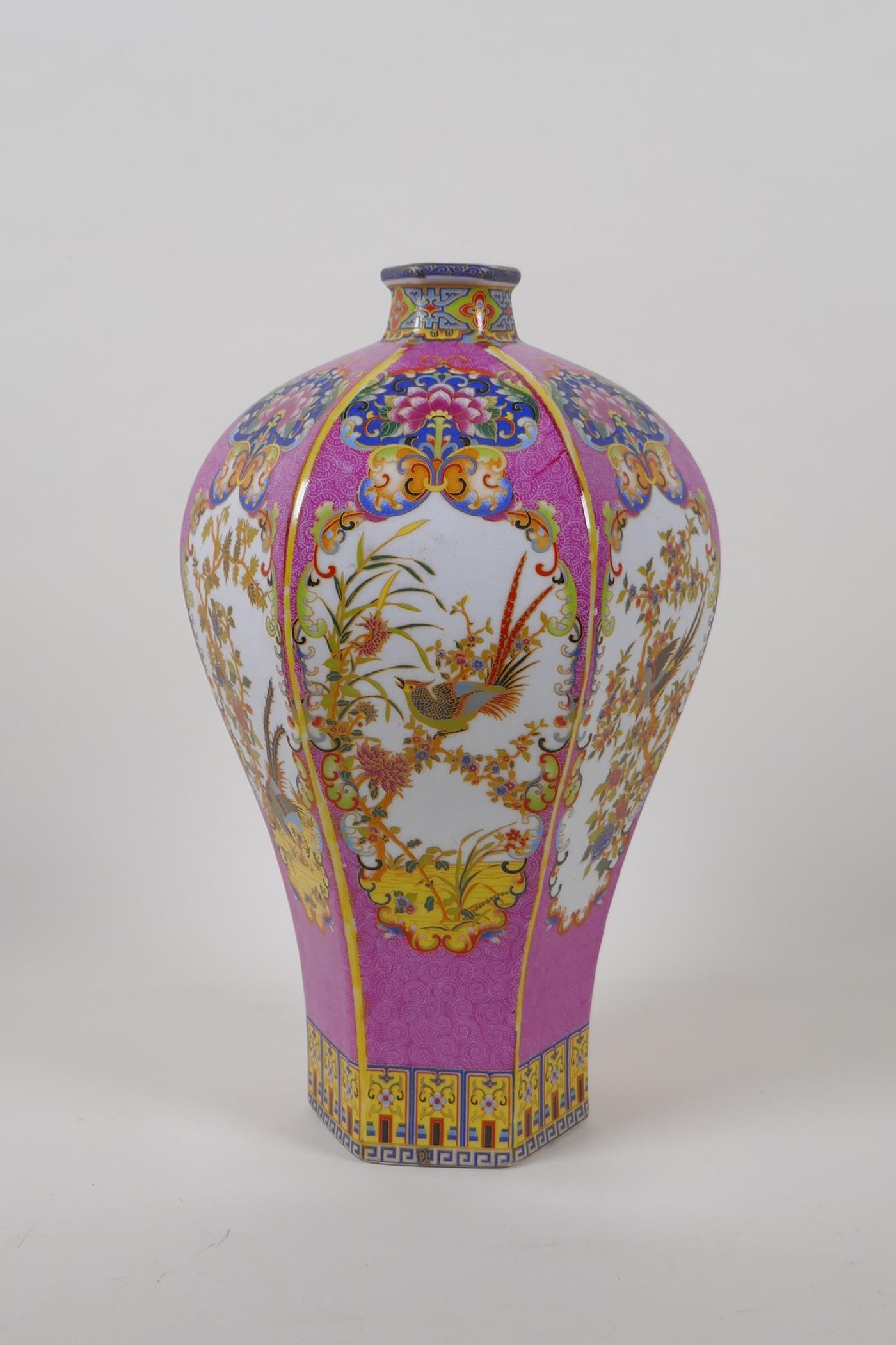 A Chinese hexagonal porcelain vase with polychrome decorative panels depicting birds on a pink