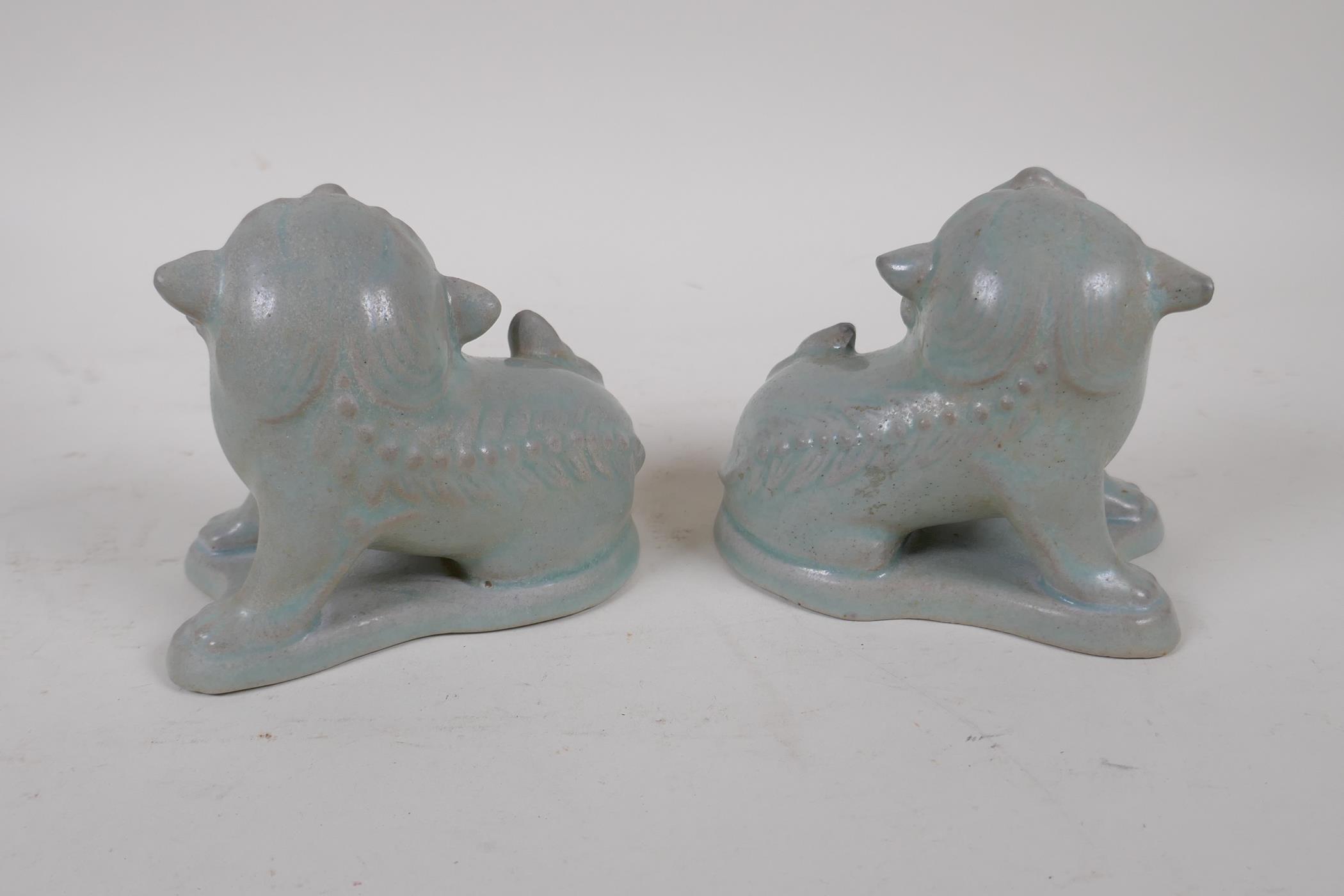 A pair of Chinese porcelain temple lions with ru-ware style glazes, 10cm high, 11cm long - Image 3 of 4