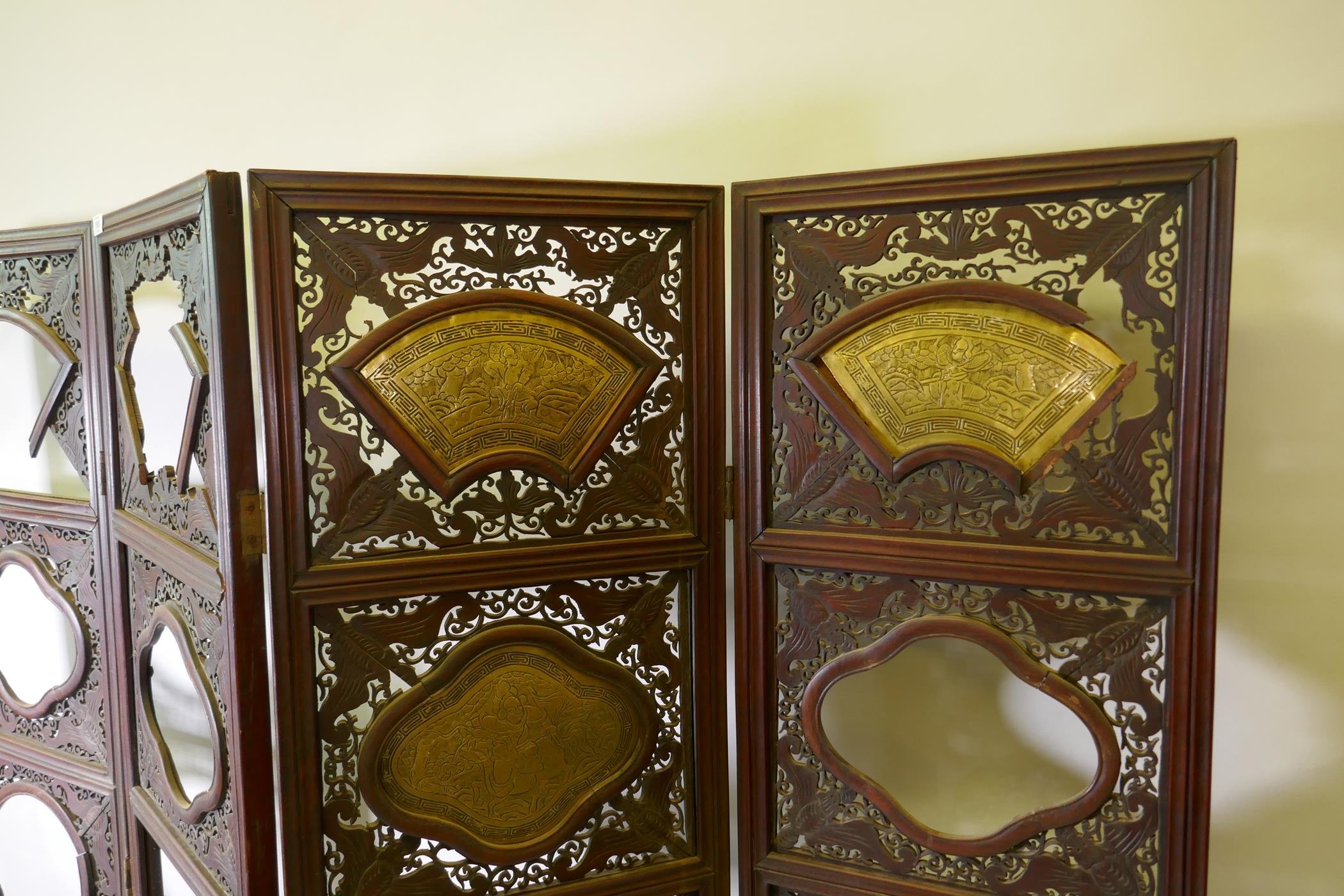 A Chinese hardwood four fold screen with fretwork panels and brass inset plaques, each panel 170 x - Image 2 of 5