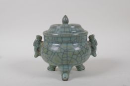 A Chinese celadon Ge ware porcelain censer and cover with two handles and tripod supports, 13cm high