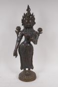 An antique bronze figure of Shiva, standing upon a dais, 50cm high