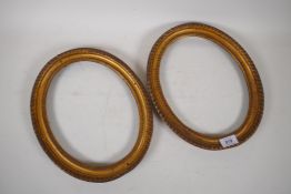 A pair of early C19th gilt brass oval picture frames, 32 x 27cm, rebate 28 x 22cm