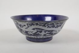 A powder blue glazed porcelain bowl with white enamel dragon decoration, Chinese Chenghua 6