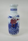 A Chinese blue and white porcelain rouleau vase with red mythical creature decoration, 45cm high