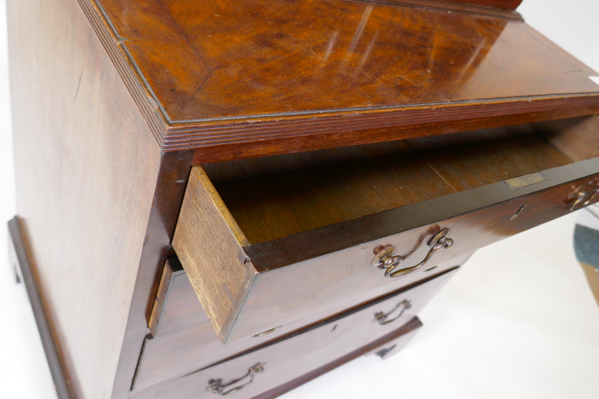 A small C19th mahogany bookcase with glazed top and base with reeded top over four oak lined drawers - Image 4 of 4