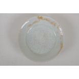 A Chinese song style celadon glazed porcelain dish with petal shaped rim and incised lotus flower