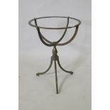 A painted iron stand, 60cm high, 46cm diameter