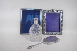 An Edwardian hallmarked silver photo frame, 16 x 22cm, 1906, and a sterling silver photo frame, 26 x