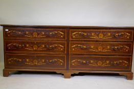 A C19th inlaid mahogany long chest comprising two flights of three long drawers with brass swan neck