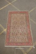 An antique Anatolian Kayseri cream ground wool rug with multi-colour all over floral design, AF wear