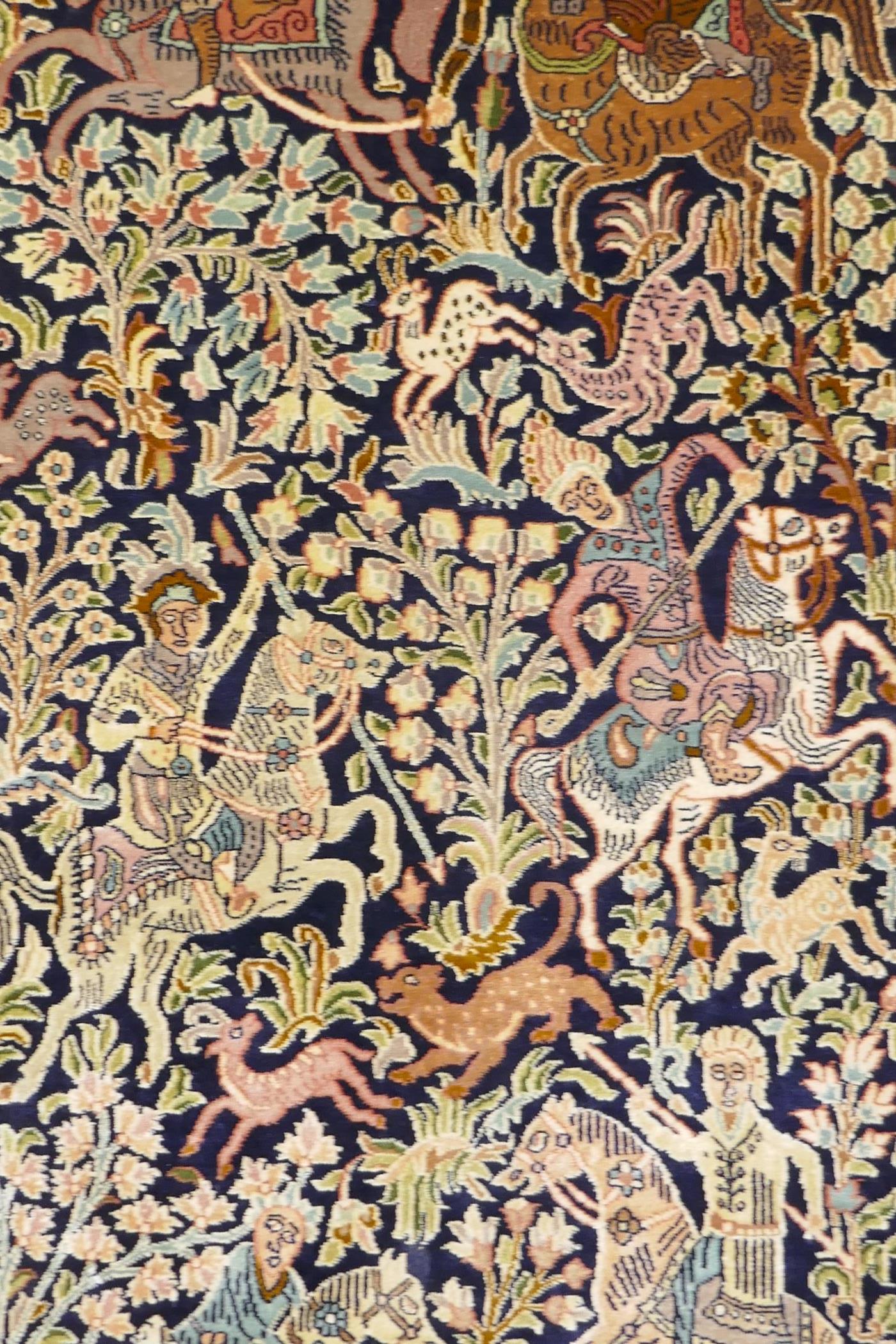 A caucasian fine silk rug with a leopard hunt design on a blue field, the red borders decorated with - Image 2 of 7