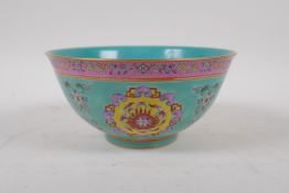 A Chinese polychrome porcelain bowl with famille rose flaming medallion decoration, mark to base,