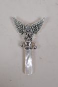 A sterling silver and mother of pearl baby's rattle in the form of an angel, 8cm