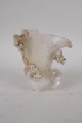 A Chinese moulded glass libation cup with climbing kylin decoration, 9cm high