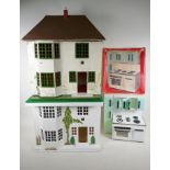 A vintage Triang dolls' house, 53cm high, 46cm wide, a scratch built dolls' house and a Cucina LAC