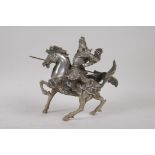 A Chinese white metal figure of the warrior Guan Gong (Guan Yu) on horseback, 19cm high