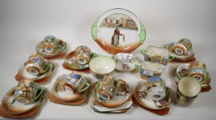 A Royal Doulton 'Dickens Ware' part tea set comprising serving plate, eleven square tea plates,