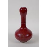 A flambe glazed porcelain garlic head shaped vase, Chinese Kangxi 6 character mark to base, 21cm