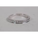 An 18ct white gold and diamond half eternity ring, approx 50 points, size M