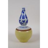 A Chinese blue and white porcelain double gourd stem vase with a yellow glazed base, 21cm high