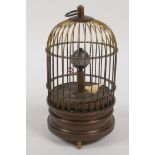 A desk clock in the form of a bird in a cage, 5½" high