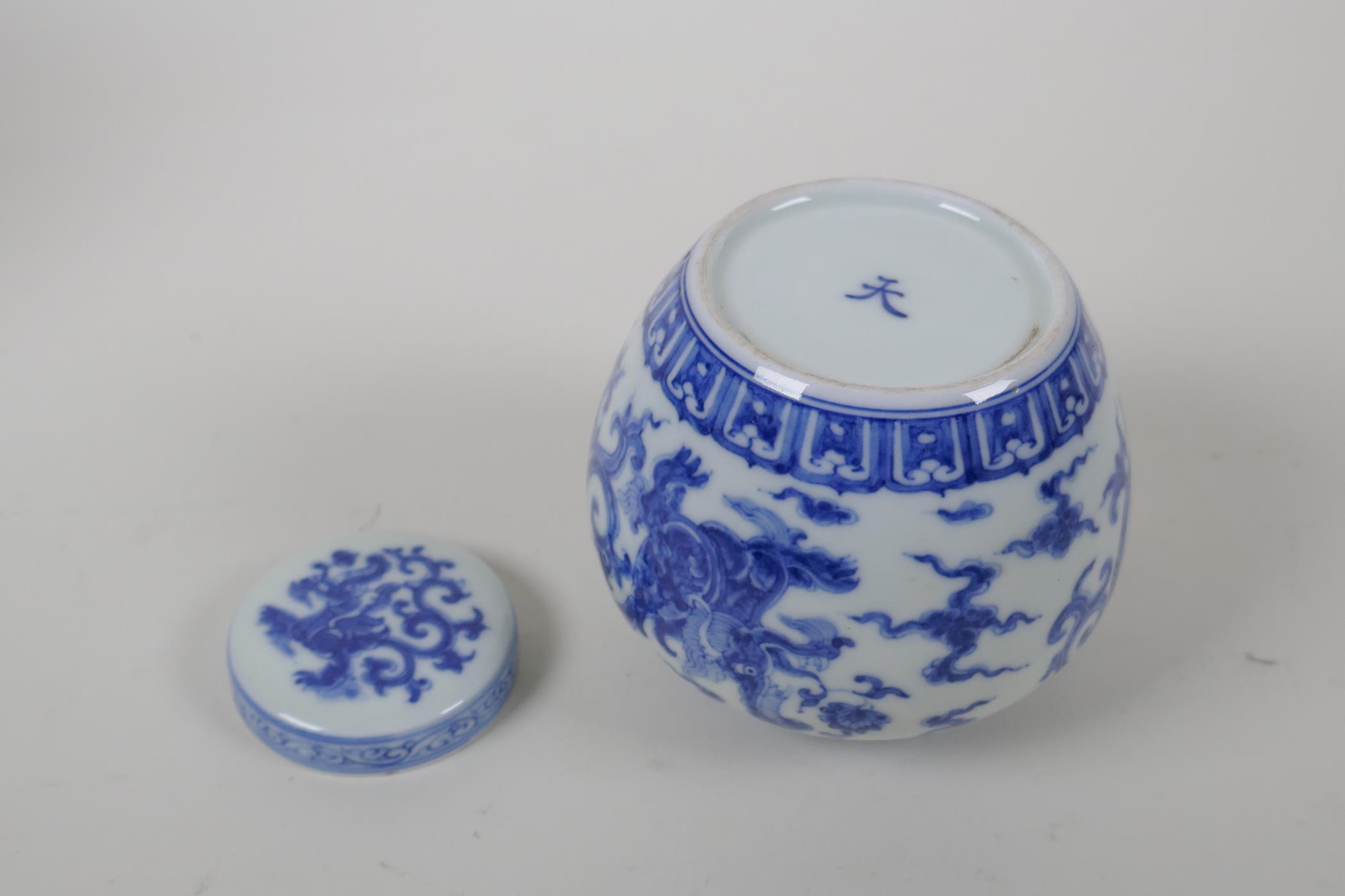 A Chinese blue and white porcelain ginger jar and cover, with scrolling dragon decoration, character - Image 6 of 7