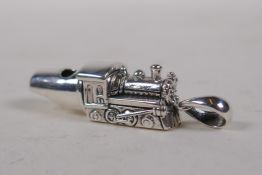 A sterling silver whistle in the form of a train, 5cm long