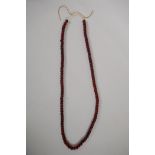 A string of horn beads, 88cm long
