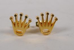 A pair of gilt metal Rolex crown style cufflinks