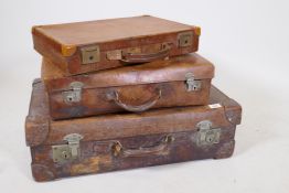A vintage leather suitcase by R.W. Forsyth, a smaller leather case and an attache case, 26" x 16"