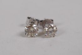 A pair of 14ct white gold and diamond stud earrings, approx 86 points