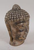 A tested silver model of Buddha's head, 14cm high, 310g