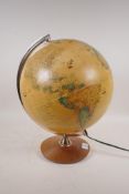 An illuminated terrestrial globe, 40cm high