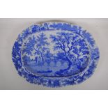 A C19th Henshall & Co blue and white transfer meat plate with castle and bridge decoration, AF