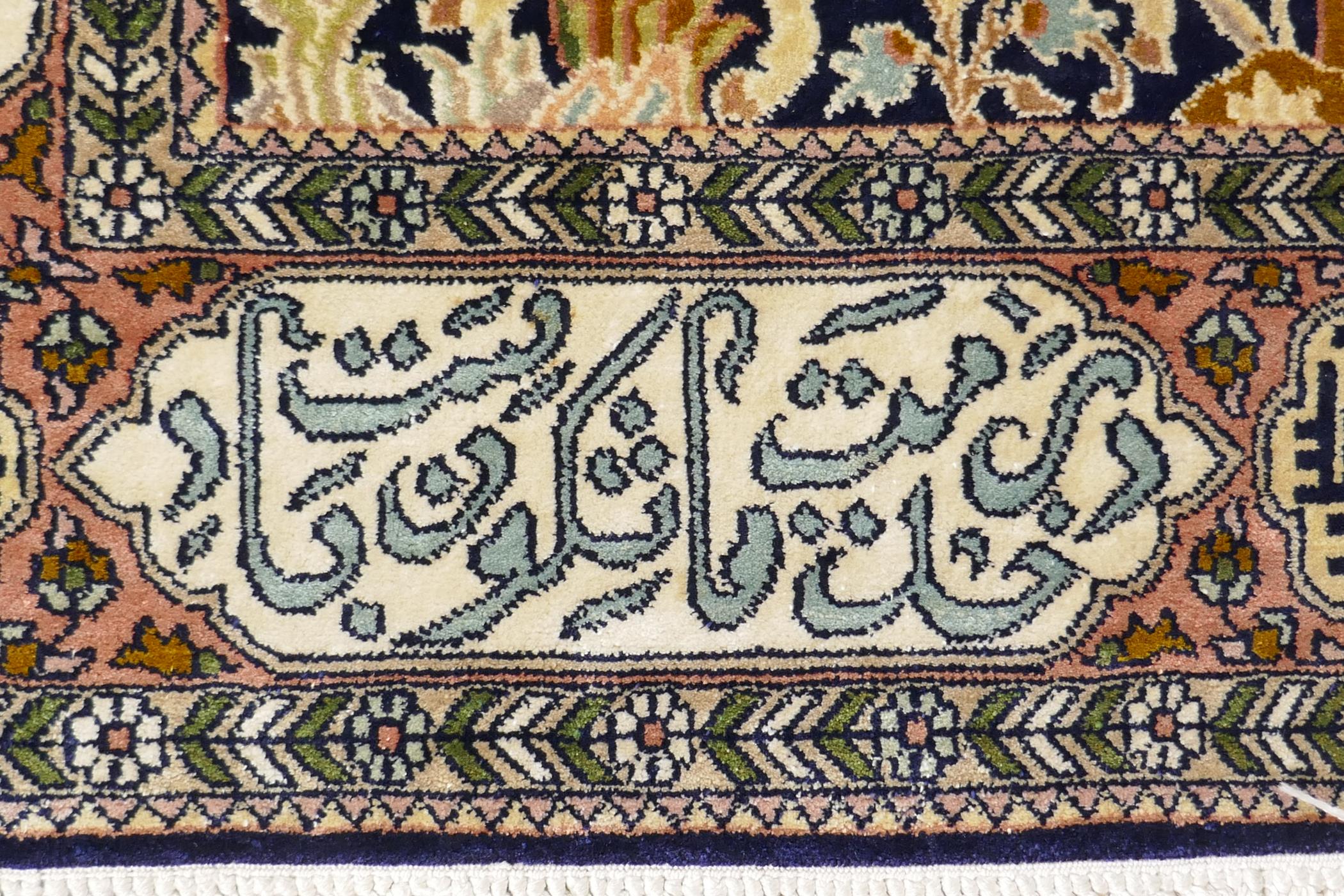 A caucasian fine silk rug with a leopard hunt design on a blue field, the red borders decorated with - Image 3 of 7