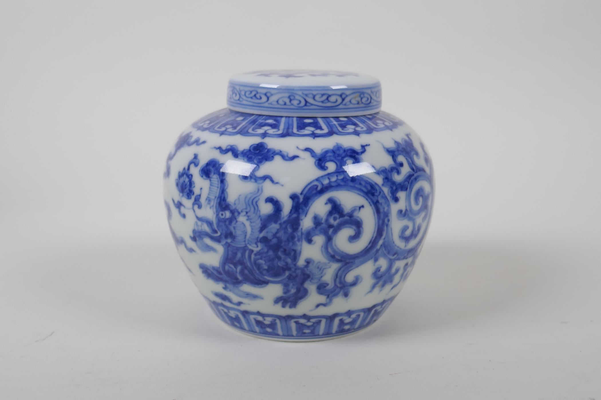 A Chinese blue and white porcelain ginger jar and cover, with scrolling dragon decoration, character