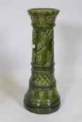 A Burmantofts faience green majolica glazed jardiniere stand, 70cm high