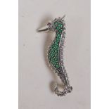 A 925 silver sea horse brooch, set with green and red stones, 5cm long