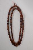 A string of horn mala beads, 150cm long