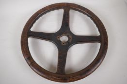 A vintage wood and shagreen four spoke steering wheel, 43cm diameter