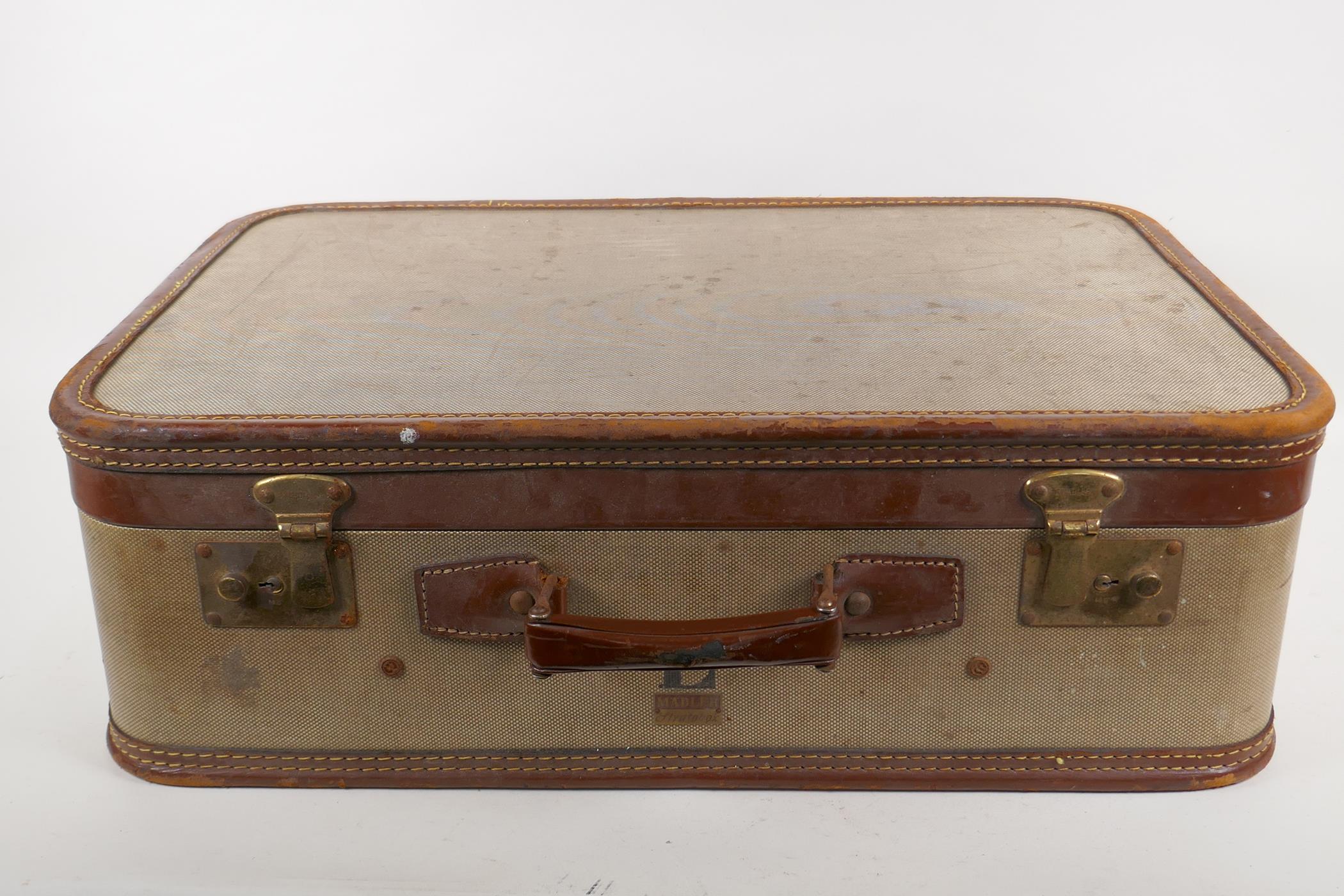 A mid century Madler Stratobox suitcase, with stitched leather trim, AF damage to back corner, 56