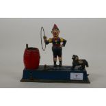 An early C20th American Hubley 'Trick Dog' cold painted cast iron money box, 22 x 18cm