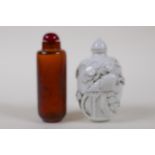 A Chinese gold flake amber glass snuff bottle and a blanc de chine porcelain snuff bottle, 8cm high