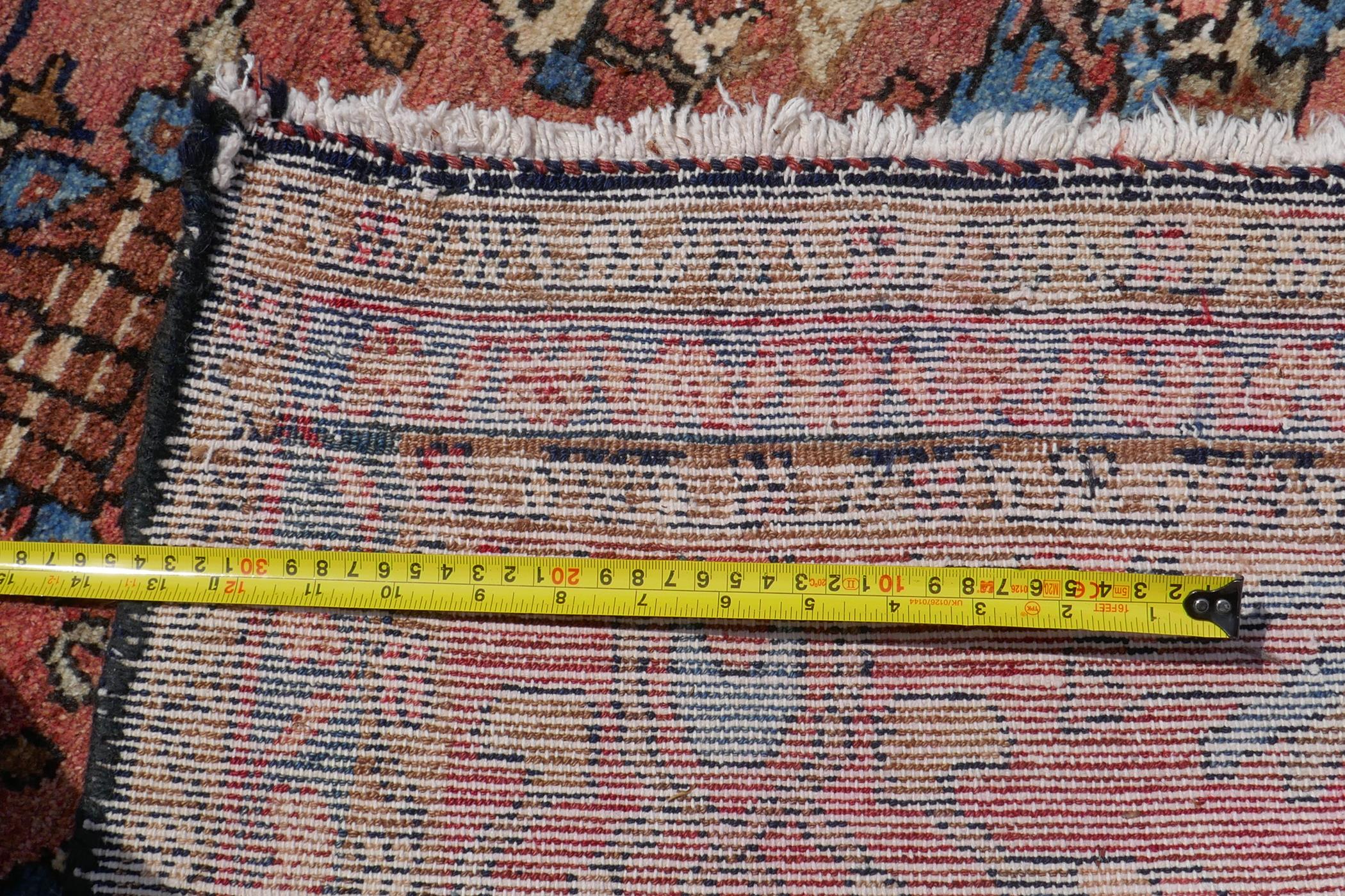 A washed terracotta ground Persian Hamadan runner, with all over floral pattern, 108cm x 284cm - Image 6 of 6