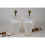 A pair of lustre glazed ceramic table lamps, 26cm high