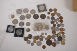 A quantity of UK and world coins including eleven 1980s UK £2, and a 1969 US Kennedy half dollar